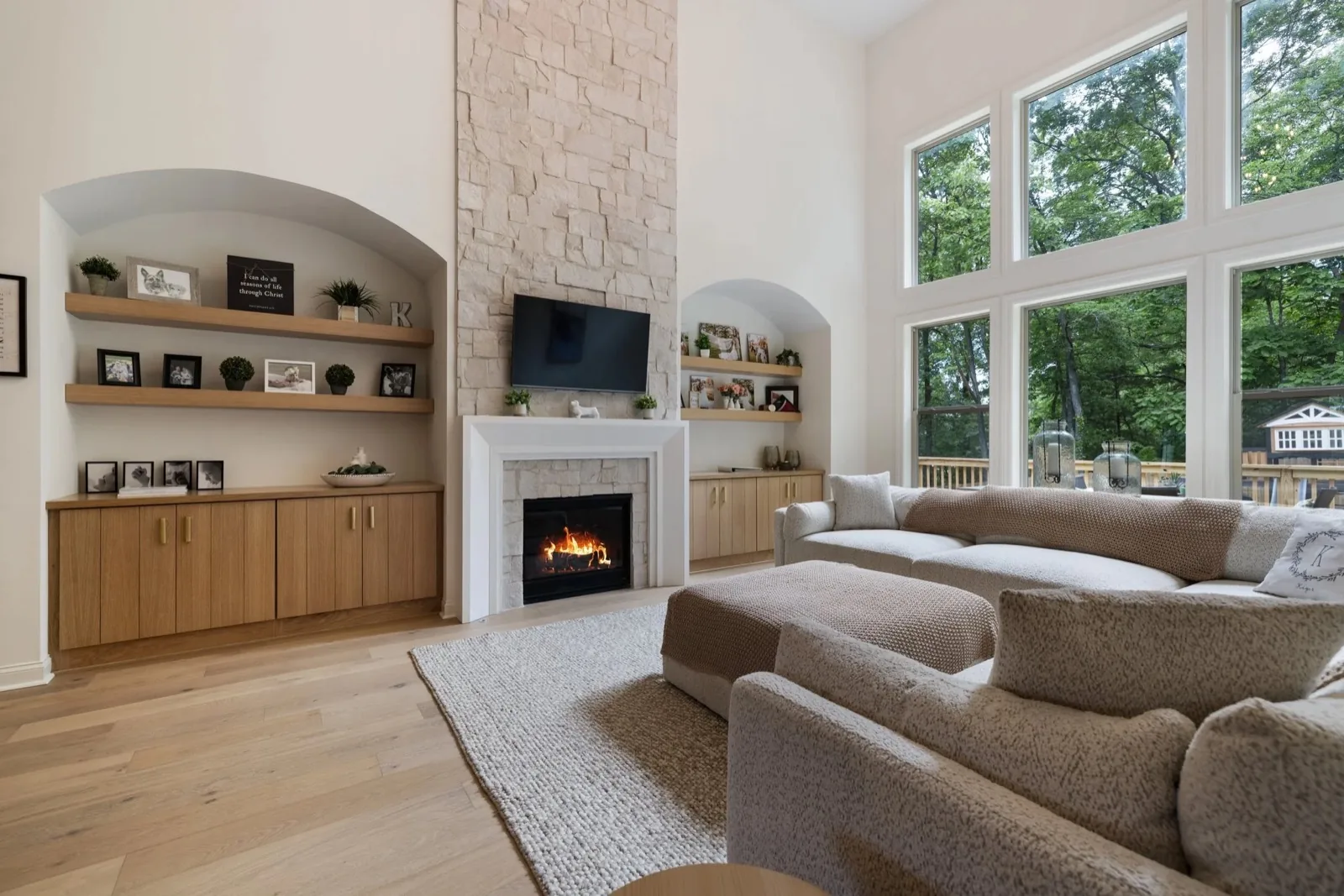Expanded living room addition with stone fireplace